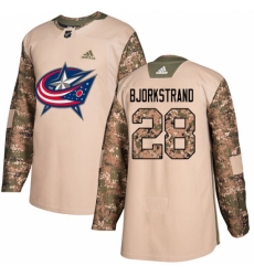 Men's Adidas Columbus Blue Jackets #28 Oliver Bjorkstrand Authentic Camo Veterans Day Practice NHL Jersey